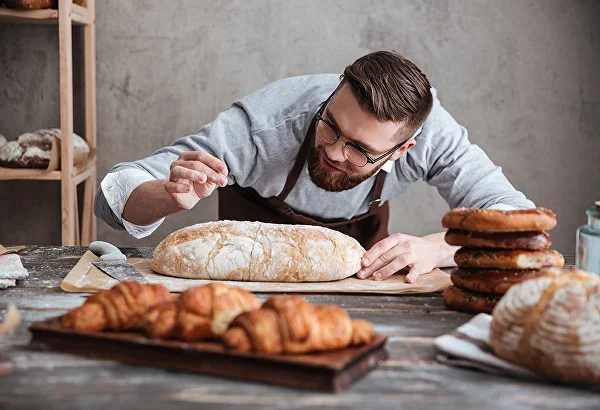 Baker mixing dough